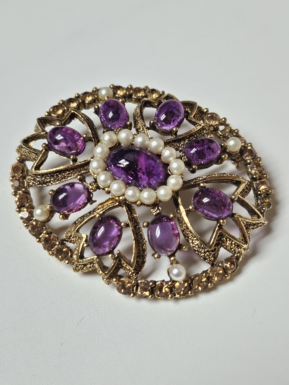 Gold-Tone Brooch with Purple Cabochons and Pearl Halo